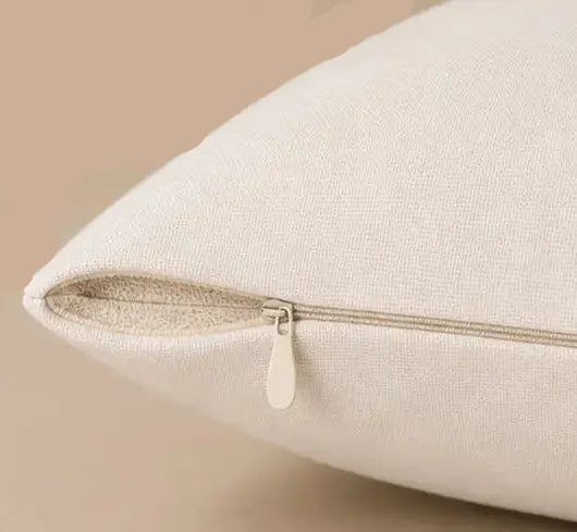 Close-up of a beige pillow Together Is Our Favorite Place - Decorative Throw Pillow  with a zipper on a beige background