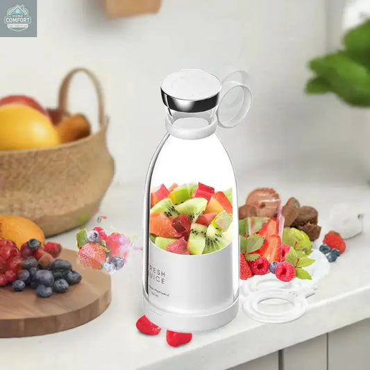 Portable personal mini blender cup with fresh fruit on kitchen counter for smoothies and juice