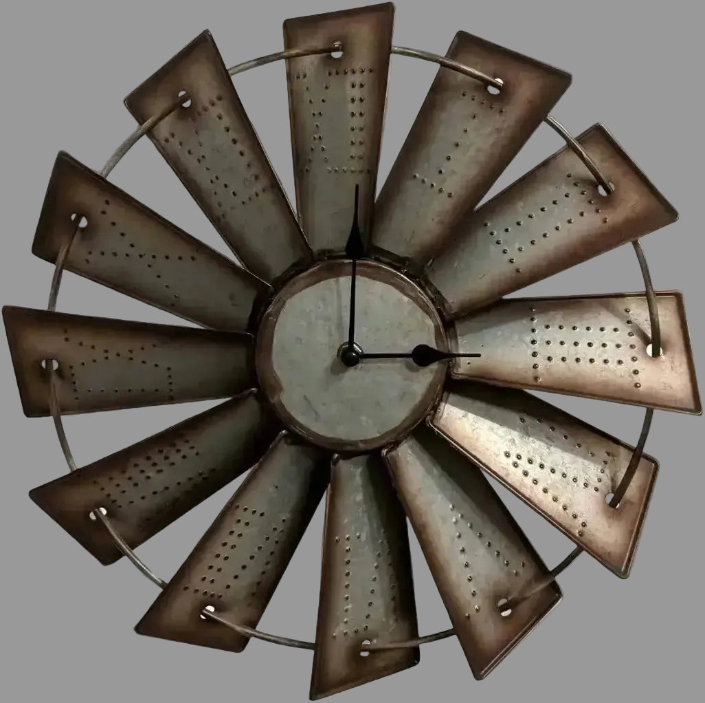 Antique metal windmill wall clock with distressed blades and Roman numeral style center, rustic farmhouse wall decor